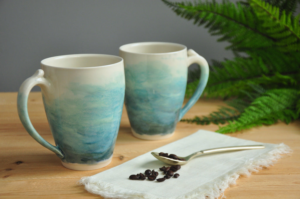 Larger Watercolor Mug - Coastal Blues blend into the handmade porcelain mug. Made in Winchester, KY