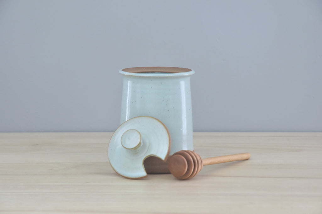 Handmade Honey Pot with Spoon from Dirty South Pottery in Winchester, KY - just outside of Lexington, Kentucky. Blue Glaze with speckles on dark clay.