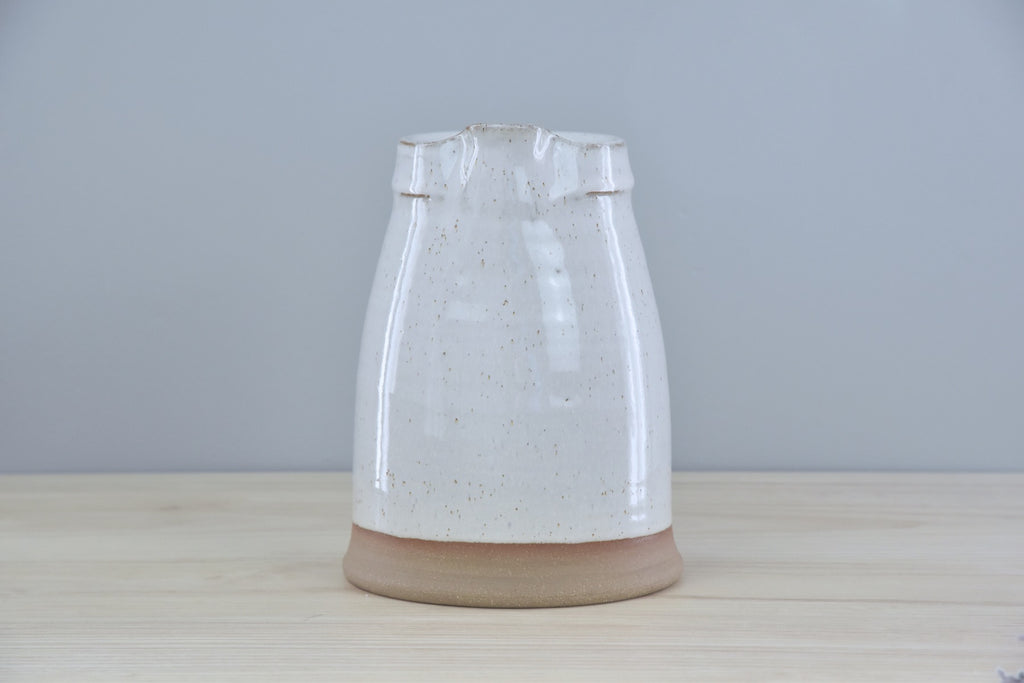 Handmade Pitcher from Dirty South Pottery in Winchester, KY - just outside of Lexington, Kentucky. White Glaze with speckles on dark clay.