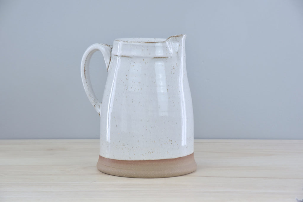 Handmade Pitcher from Dirty South Pottery in Winchester, KY - just outside of Lexington, Kentucky. White Glaze with speckles on dark clay.