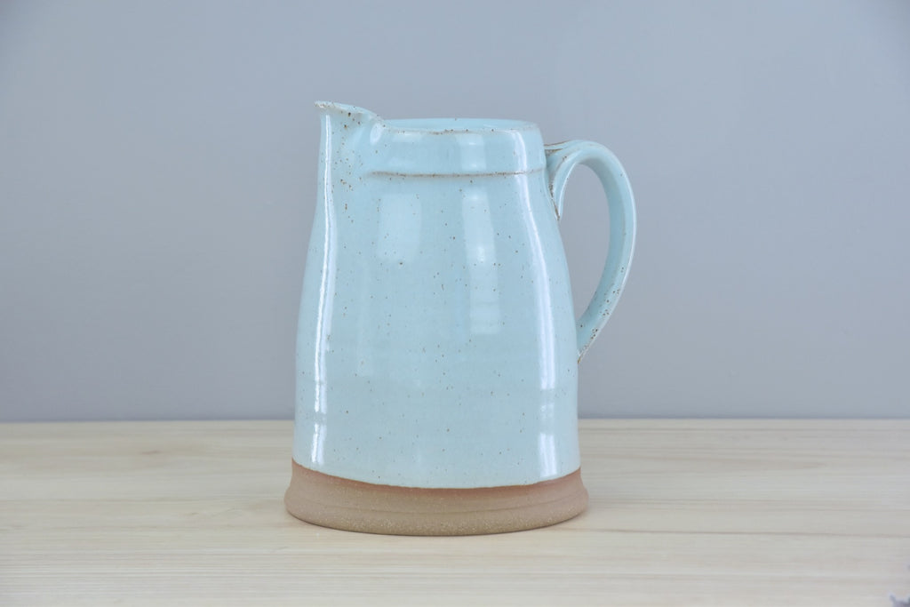 Handmade Pitcher from Dirty South Pottery in Winchester, KY - just outside of Lexington, Kentucky. White & Blue Glaze with speckles on dark clay.