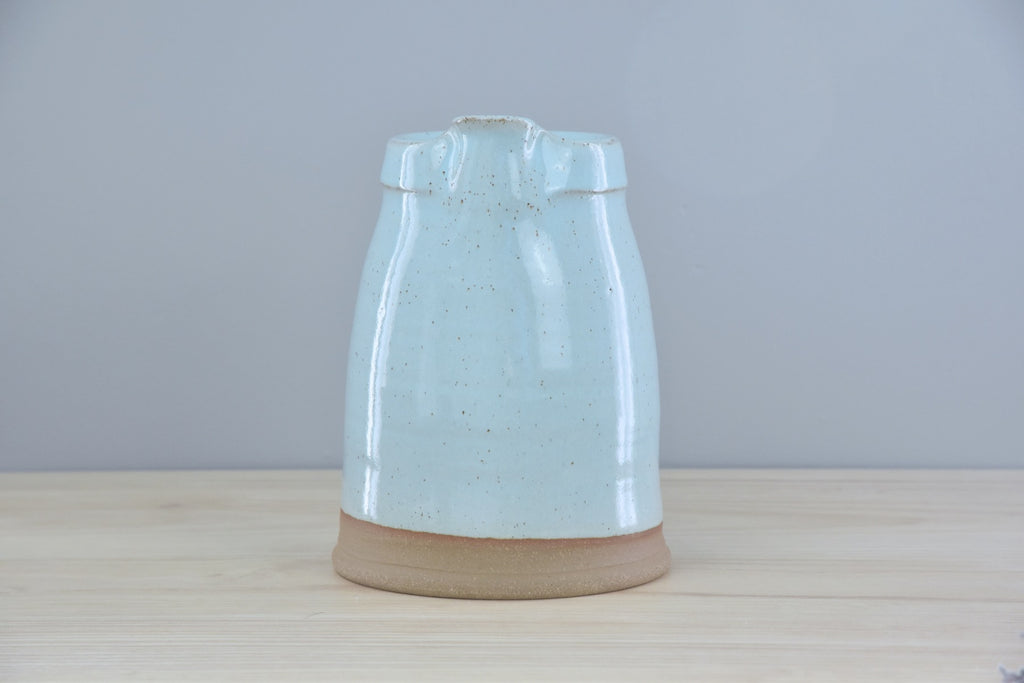 Handmade Pitcher from Dirty South Pottery in Winchester, KY - just outside of Lexington, Kentucky. White & Blue Glaze with speckles on dark clay.