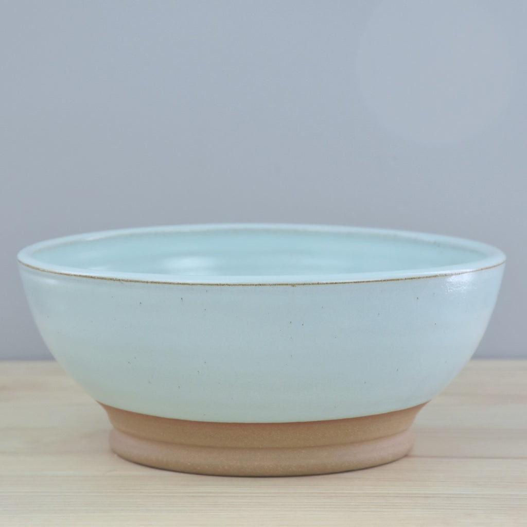 Handmade pottery - ceramic serving bowl made in Winchester, KY by Dirty South Pottery. Large handmade serving bowl in light turquoise blue glaze with speckles.