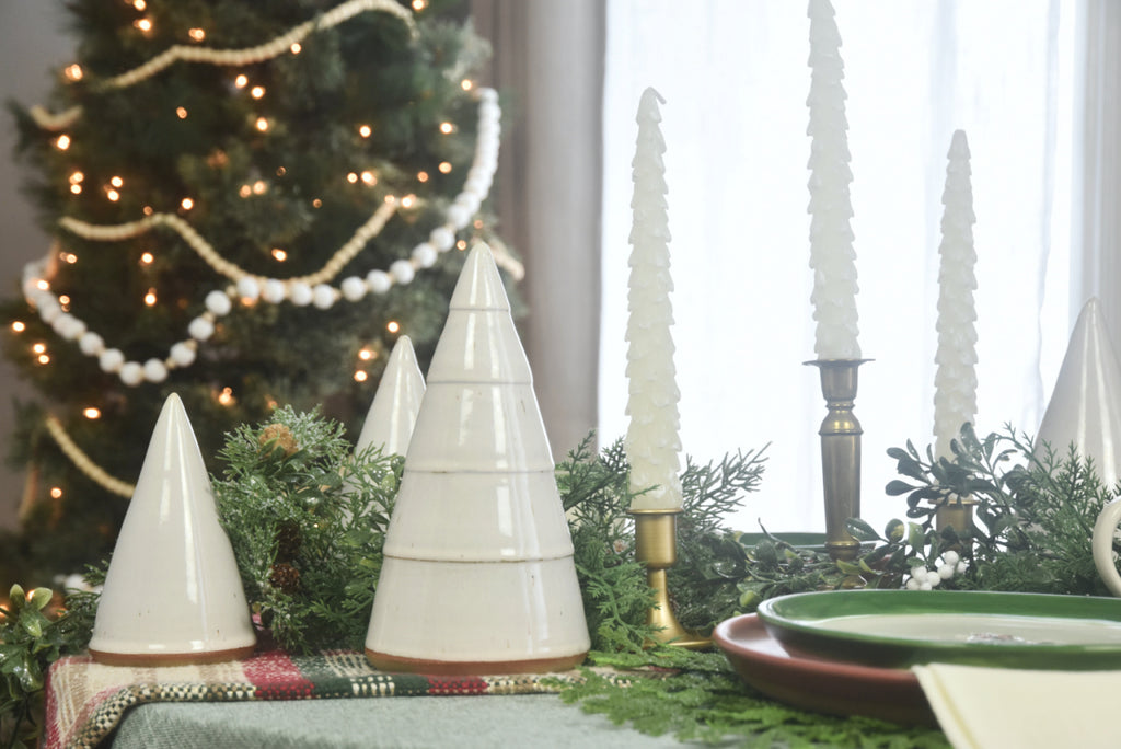 Handmade ceramic white Christmas trees in small, medium, large