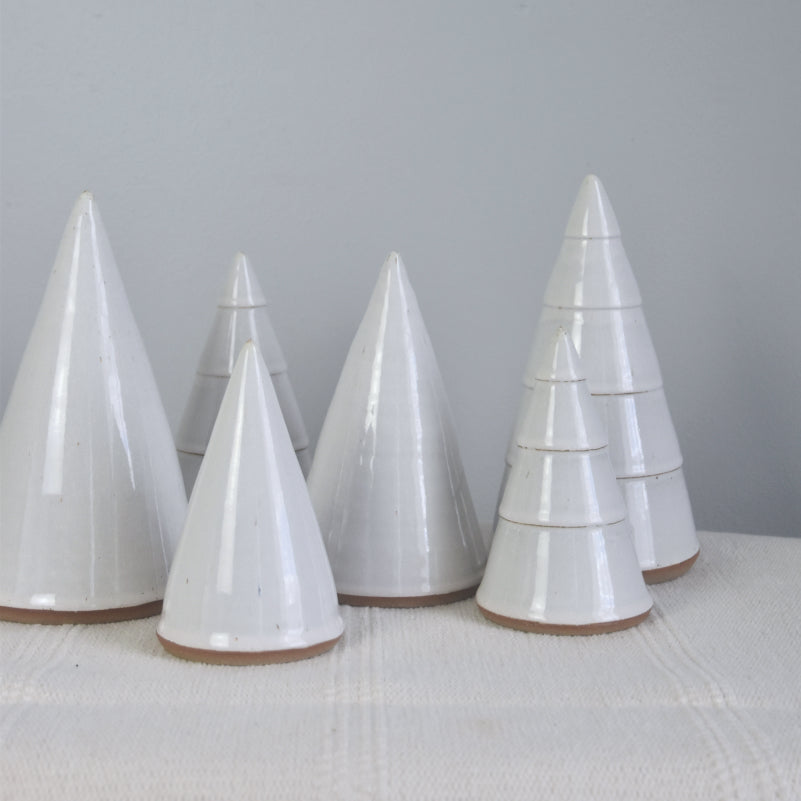 Handmade ceramic white Christmas trees in small, medium, large