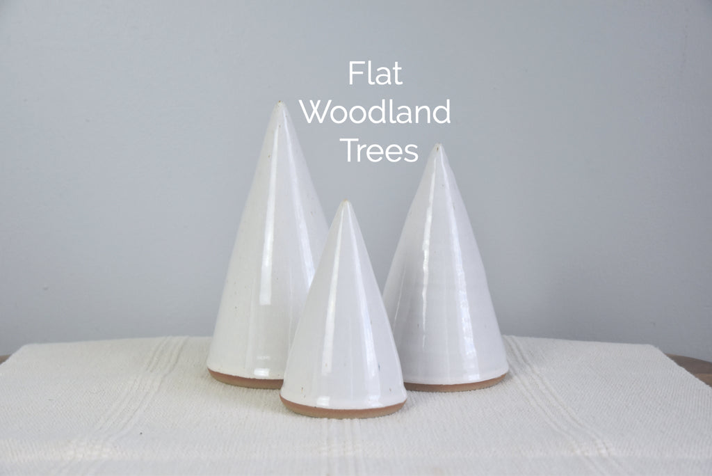 Handmade ceramic white Christmas trees in small, medium, large