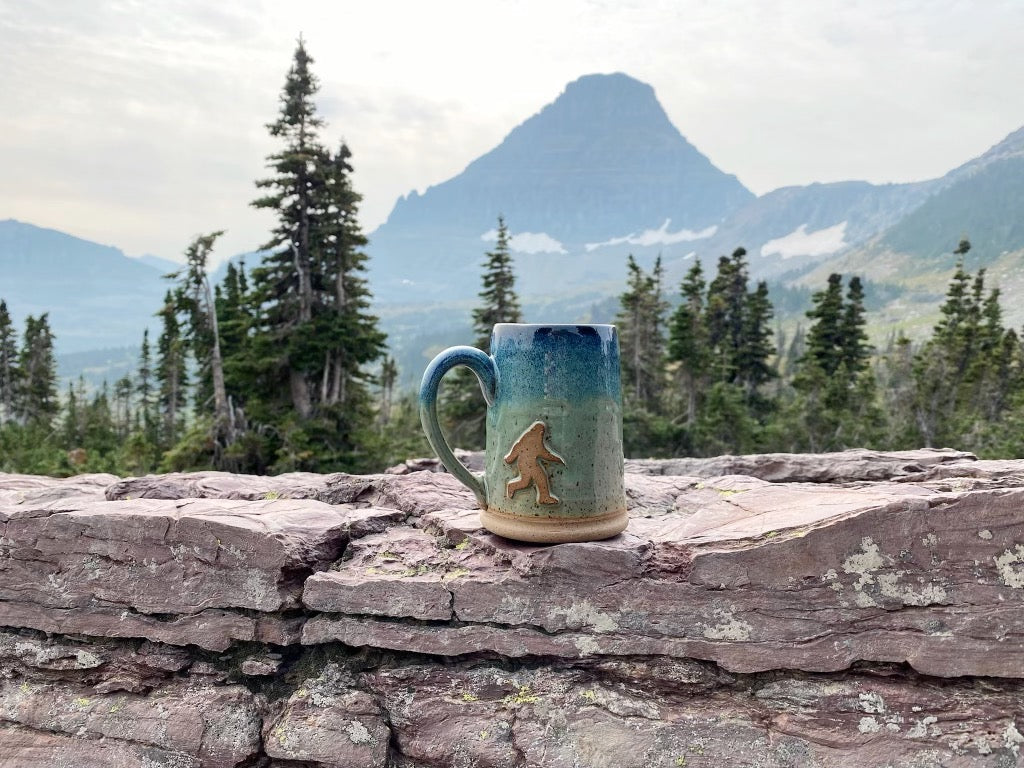 Bigfoot Mug with mountains in the background . Handmade mug from Winchester, KY