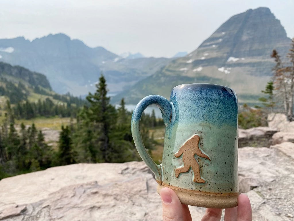 Bigfoot Mug with mountains in the background . Handmade mug from Winchester, KY