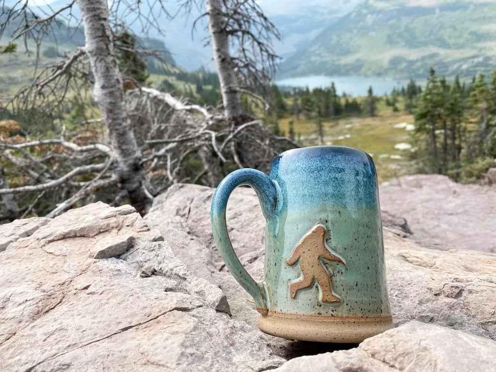 Bigfoot Mug with mountains in the background . Handmade mug from Winchester, KY