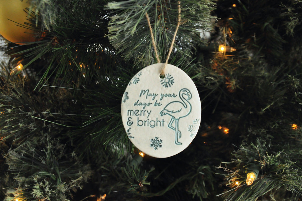 Round ornaments with 'May your days be Merry and Bright' next to a flamingo - beach, seaside, tropical ornament