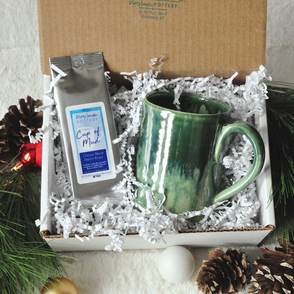 Mystery Gift Set includes a handmade Mystery Mug, Cup of Mud coffee, gift box, wrappings & a 2021 Ornament
