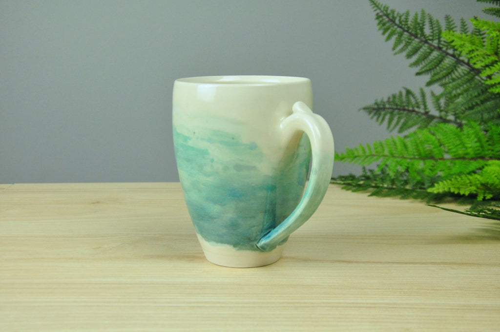 Larger Watercolor Mug - Coastal Blues blend into the handmade porcelain mug. Made in Winchester, KY